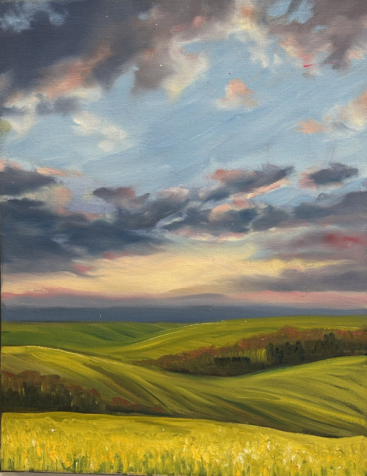 Prairie sunset over rolling green fields and a yellow canola strip, a beginners oil painting from the Levels 1-4 oil painting course at Grasby Art Studio, Calgary