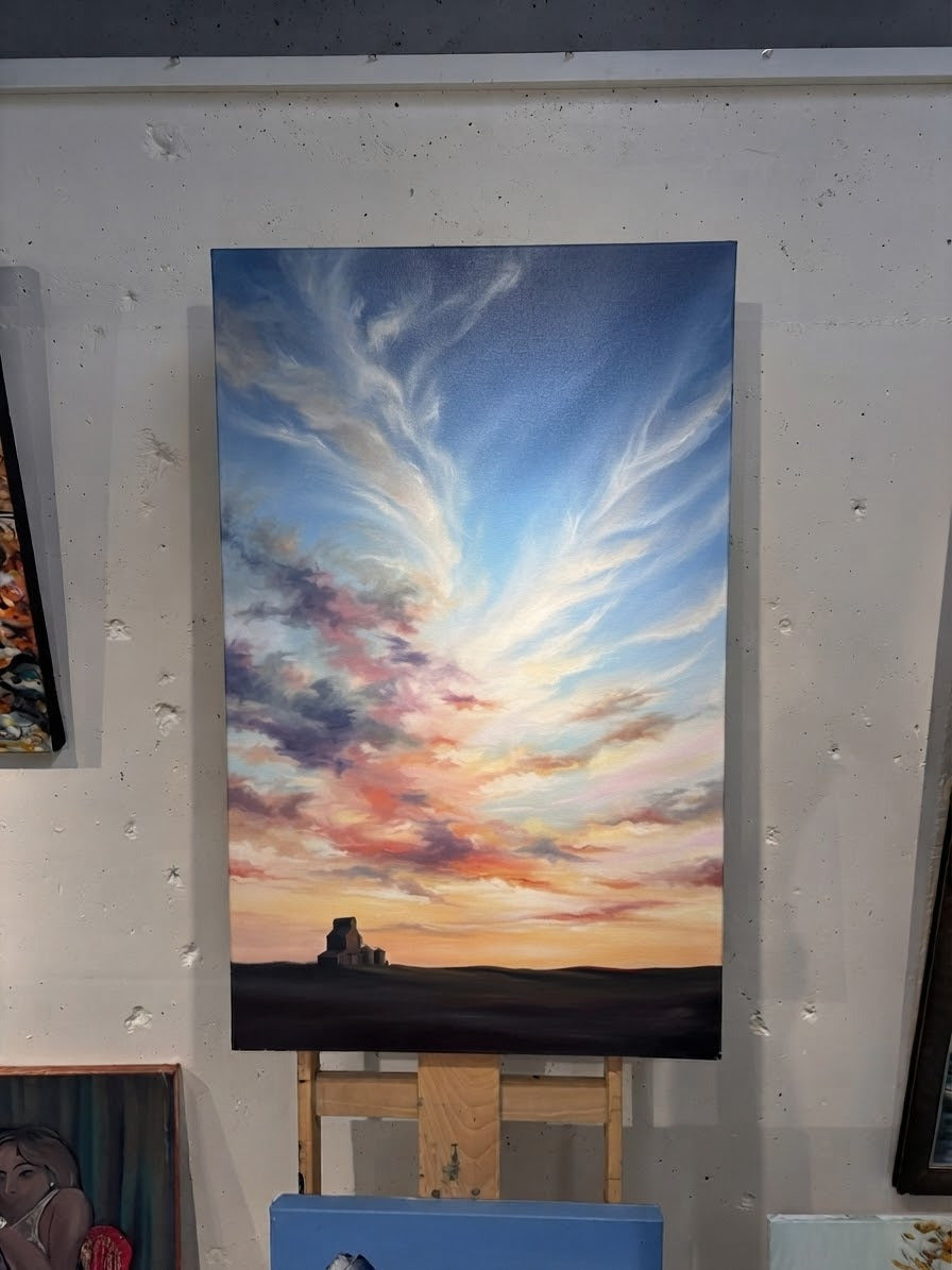 Sweeping cirrus clouds lit pink and gold at sunset above a lone prairie grain elevator, sky painting from the Prairie Skies workshop, Grasby Art Studio Calgary