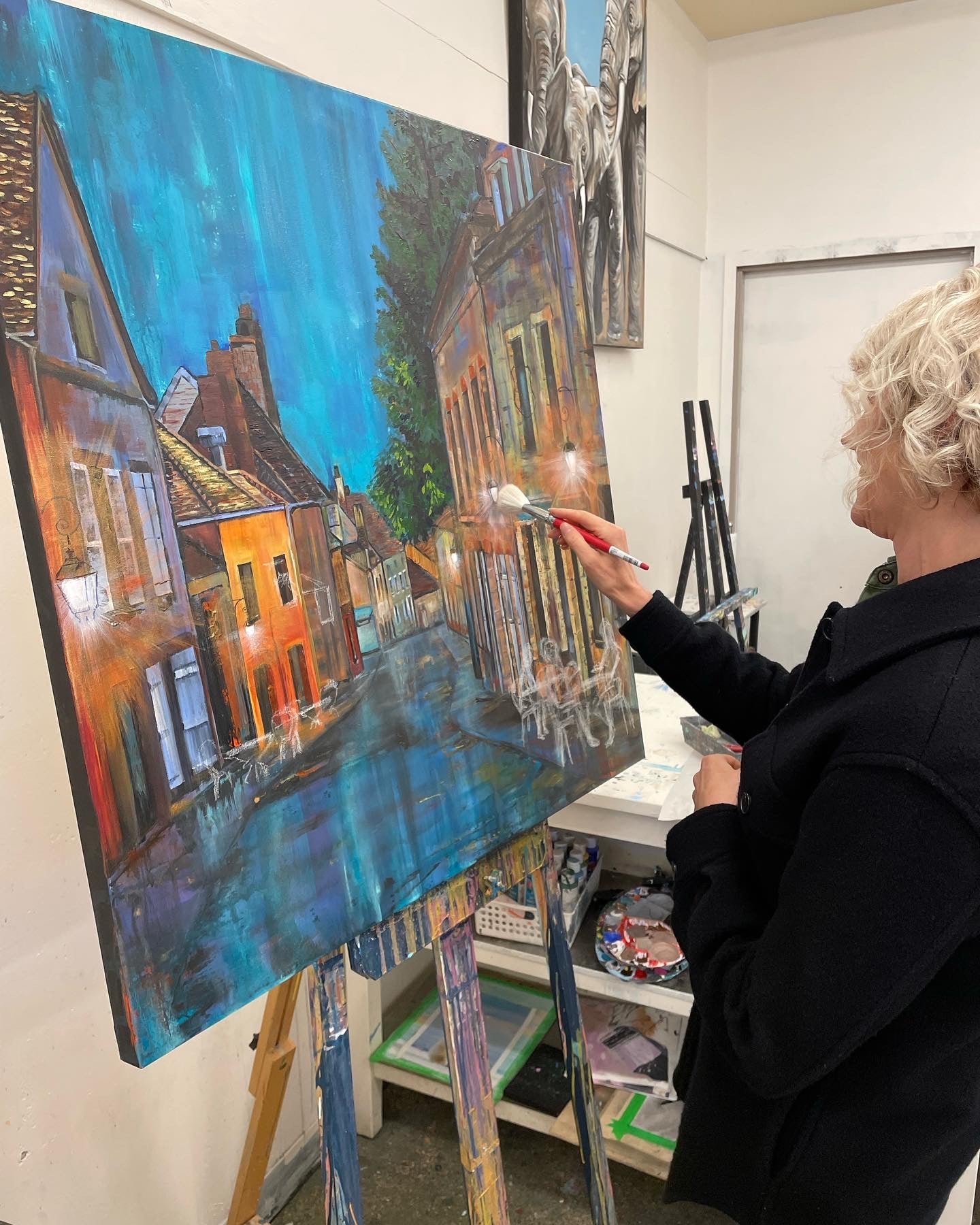 Painting a blue canal cityscape on canvas at the Cityscape Painting Workshop, Grasby Art Studio, NW Calgary