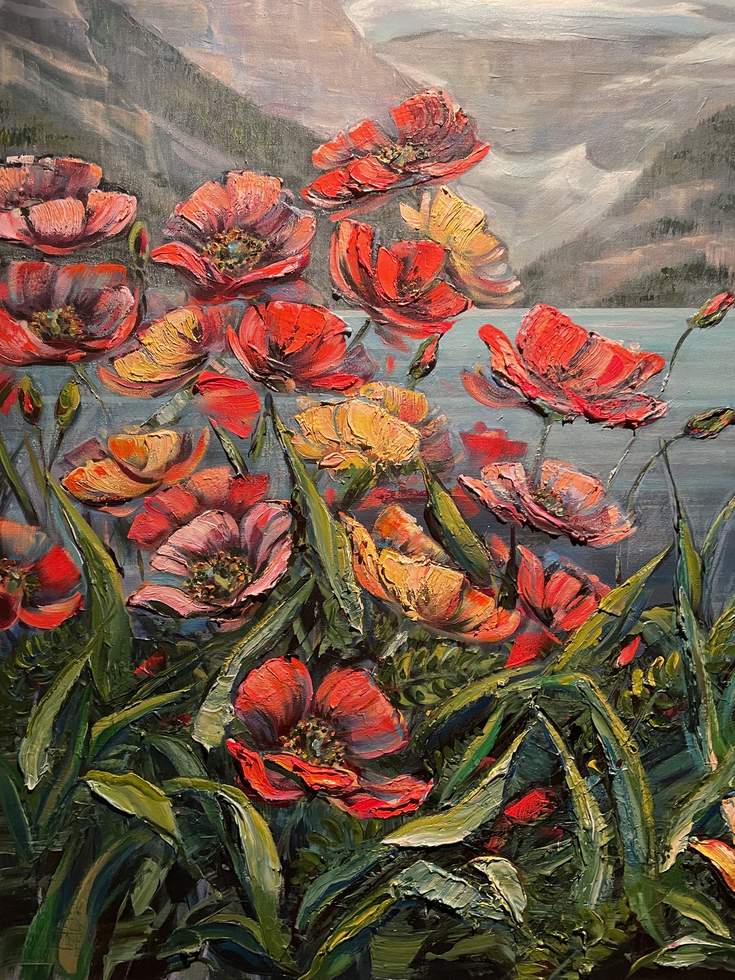 Pink, coral and yellow poppies crowding the foreground above a pale mountain lake, impasto painting by Teresa Grasby, Grasby Art Studio Calgary