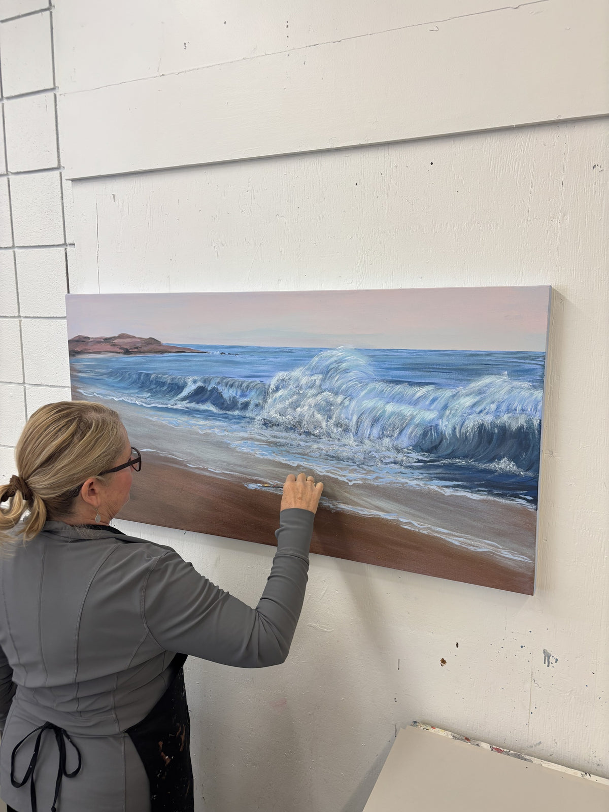 Teresa Grasby painting a large panoramic wave canvas during the Water & Waves workshop, Grasby Art Studio, NW Calgary